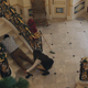 Bunny dragging an unconscious Lee down the manor steps